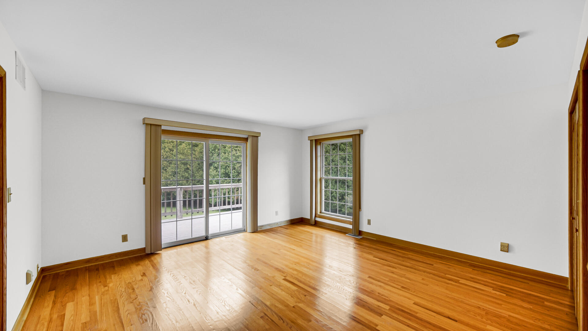 11339 West Snyder Road Westville, IN 46391 - Photo 10 of 27 a view of an empty room with wooden floor and a window