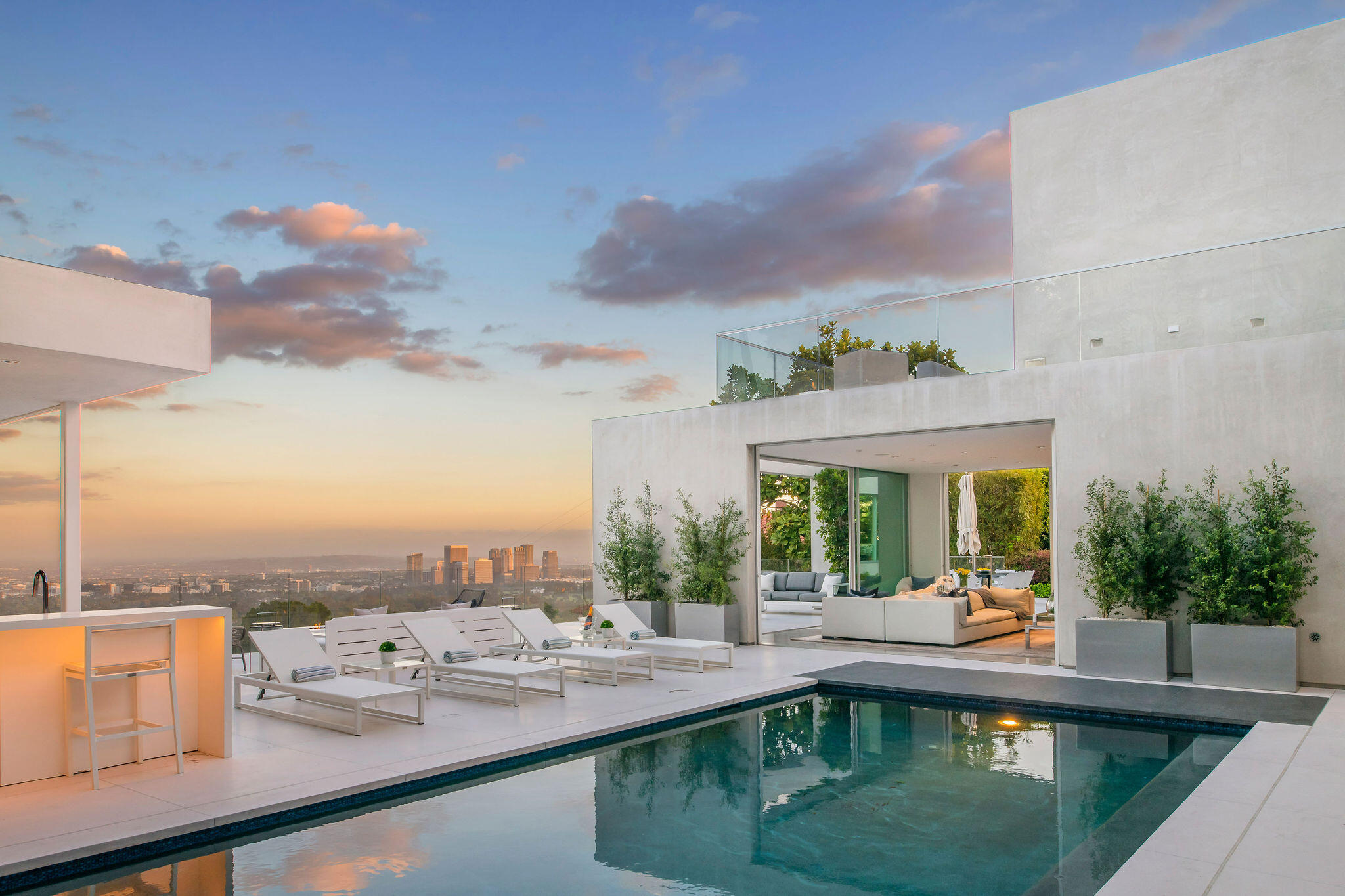 a view of a swimming pool and a back yard
