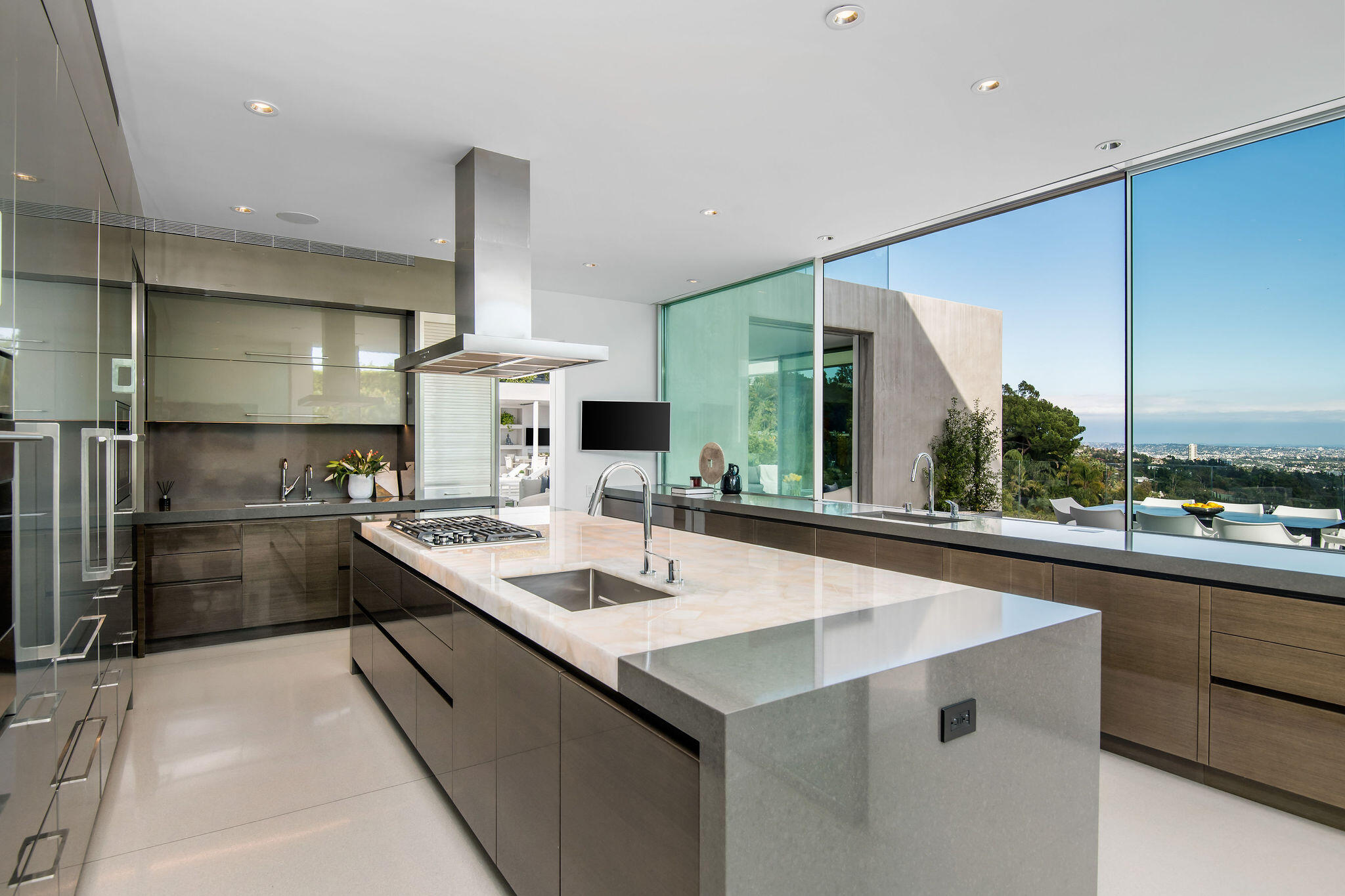 1288 Angelo Drive Beverly Hills, CA 90210 - Photo 11 of 33 a kitchen with stainless steel appliances a sink and stove