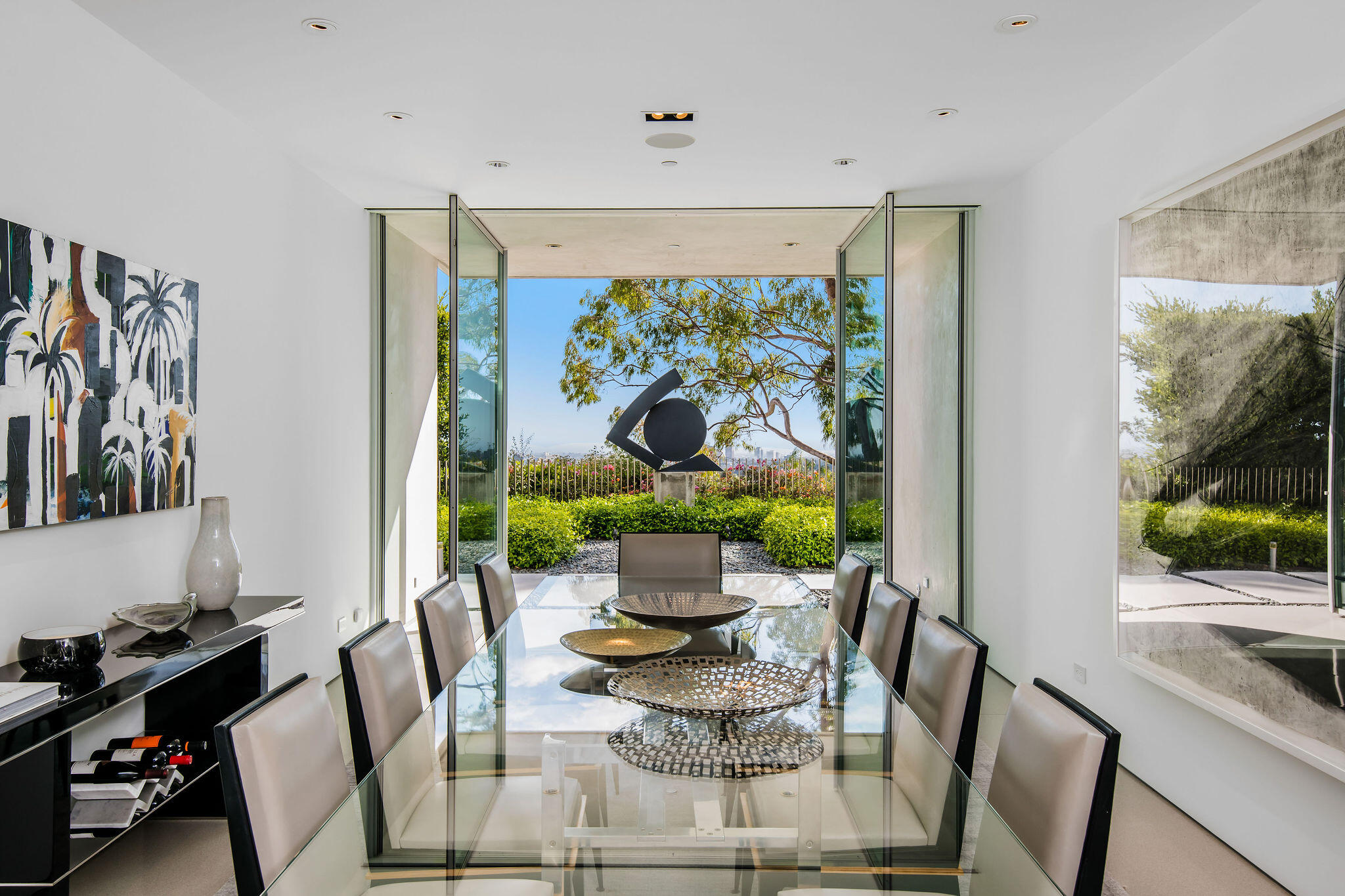 1288 Angelo Drive Beverly Hills, CA 90210 - Photo 15 of 33 a view of a dining room with furniture one side kitchen view and wooden floor
