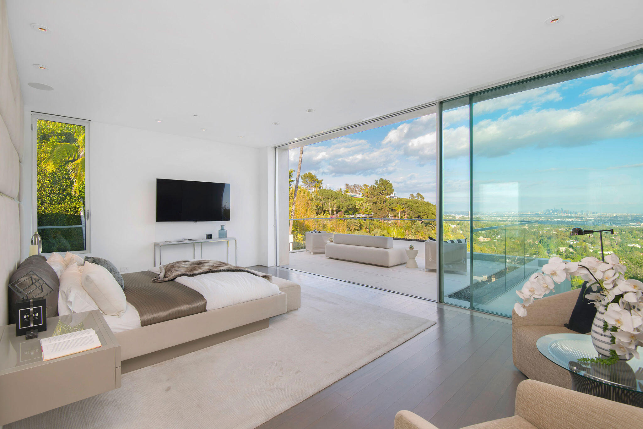 1288 Angelo Drive Beverly Hills, CA 90210 - Photo 17 of 33 a living room with furniture and a flat screen tv