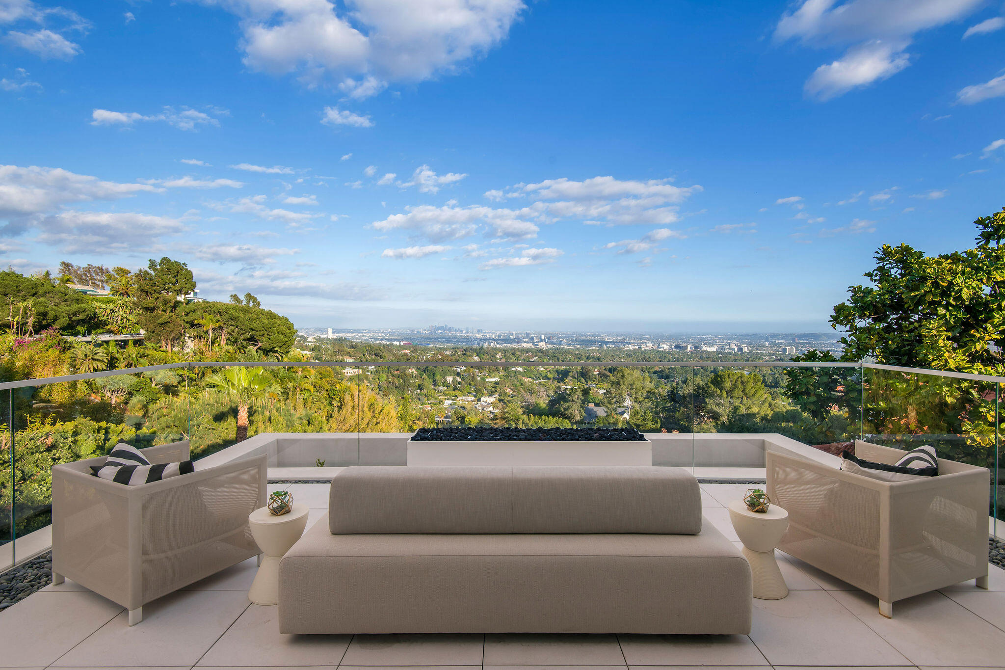 1288 Angelo Drive Beverly Hills, CA 90210 - Photo 19 of 33 a view of roof deck with couches and sky view
