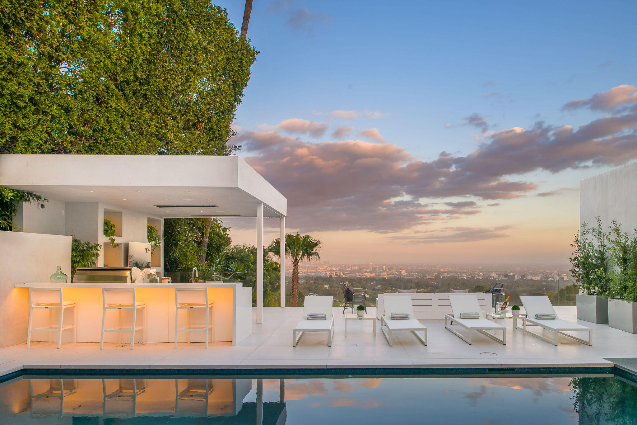 1288 Angelo Drive Beverly Hills, CA 90210 - Photo 2 of 33 a view of swimming pool with outdoor seating and plants