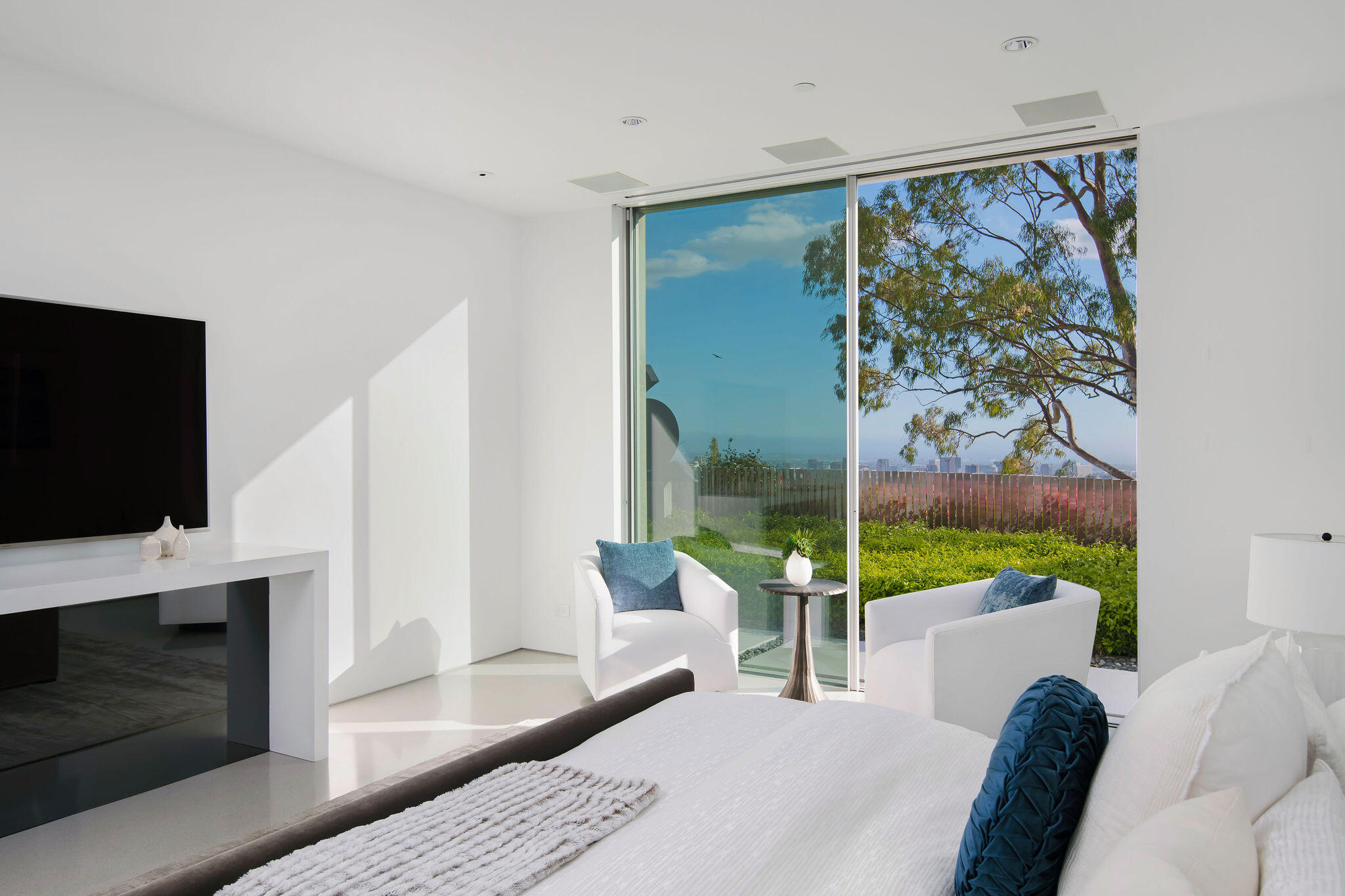 1288 Angelo Drive Beverly Hills, CA 90210 - Photo 24 of 33 a living room with furniture fireplace and flat screen tv