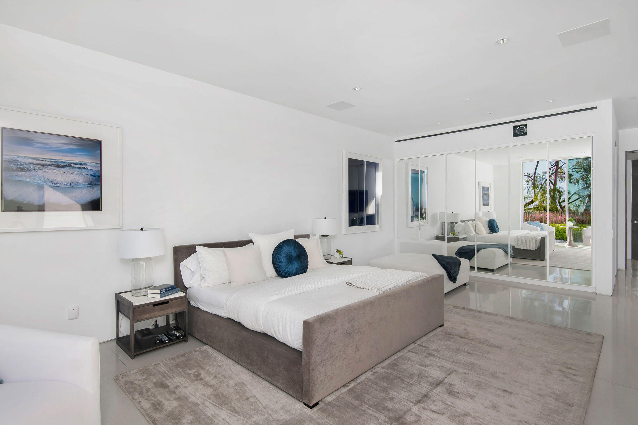 1288 Angelo Drive Beverly Hills, CA 90210 - Photo 25 of 33 a living room with furniture and a flat screen tv