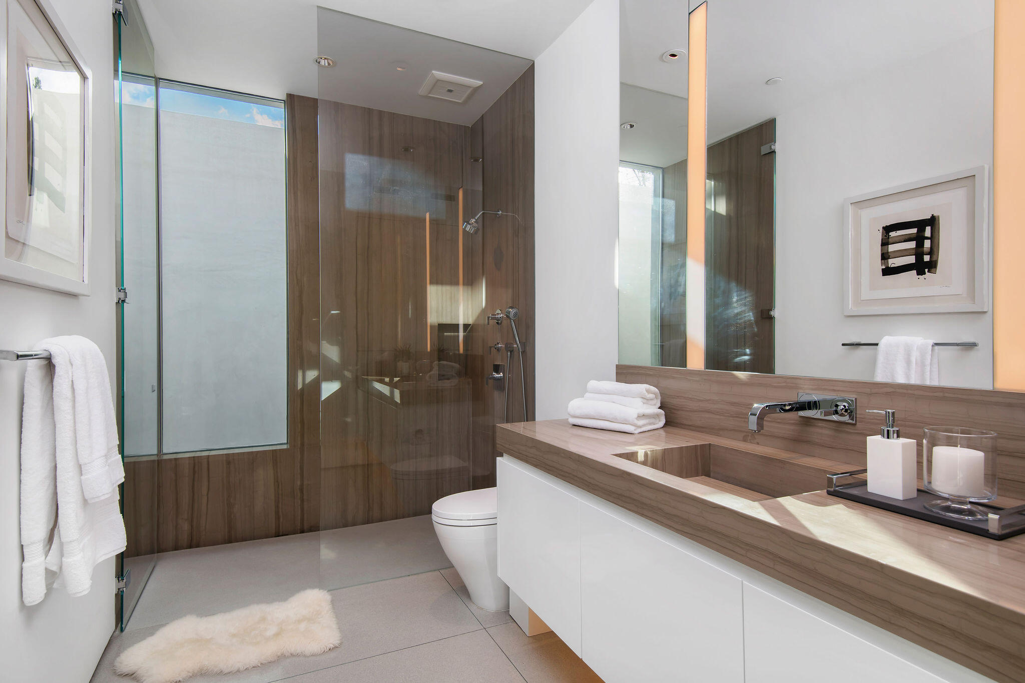 1288 Angelo Drive Beverly Hills, CA 90210 - Photo 26 of 33 a spacious bathroom with a double vanity sink a mirror and a shower