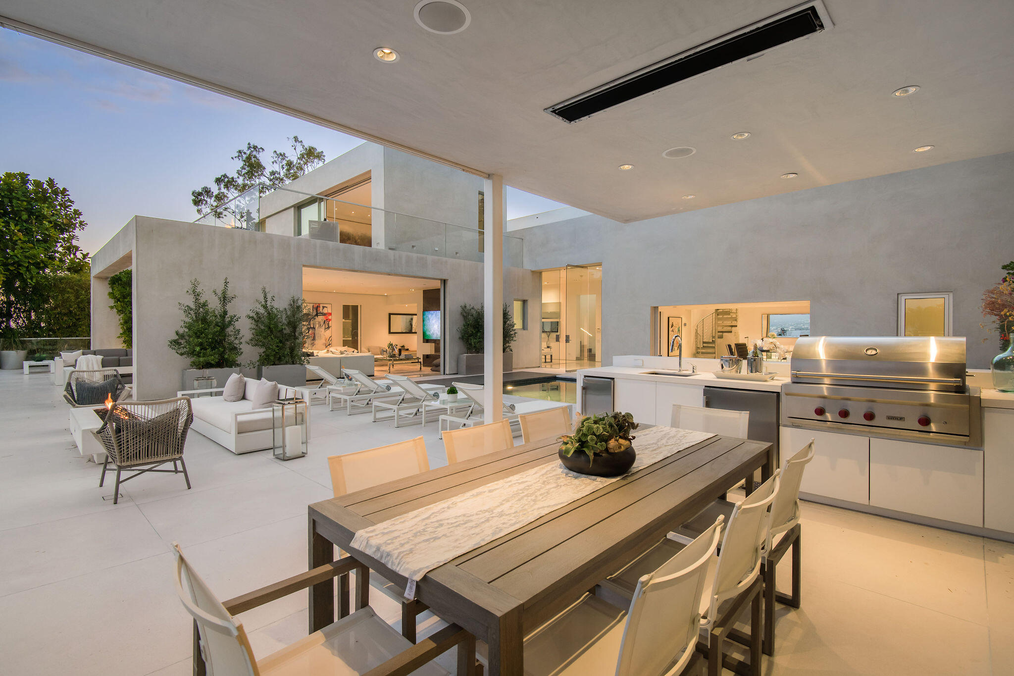 1288 Angelo Drive Beverly Hills, CA 90210 - Photo 31 of 33 a kitchen with a table and chairs in it