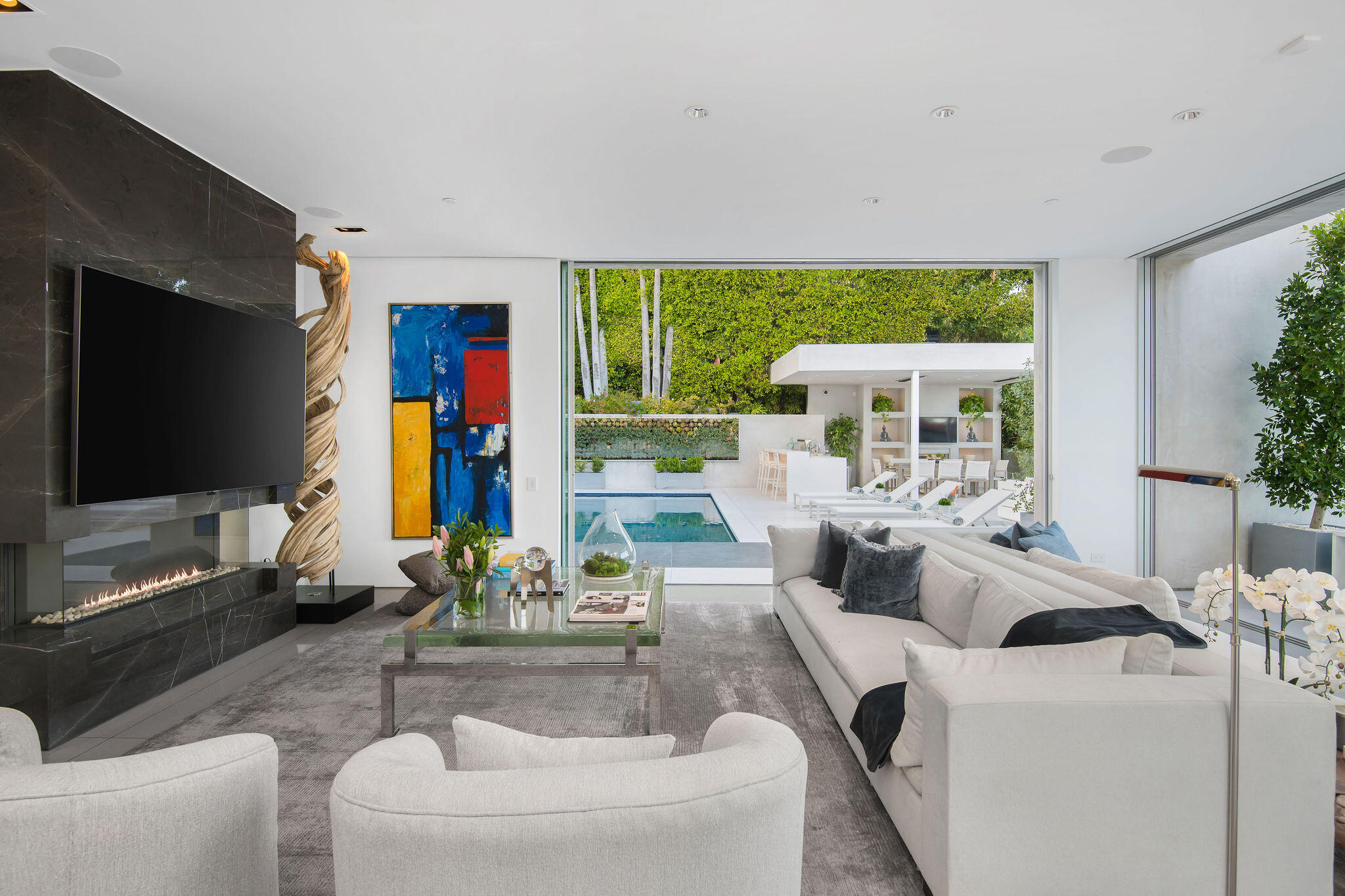 1288 Angelo Drive Beverly Hills, CA 90210 - Photo 6 of 33 a living room with fireplace furniture and a flat screen tv