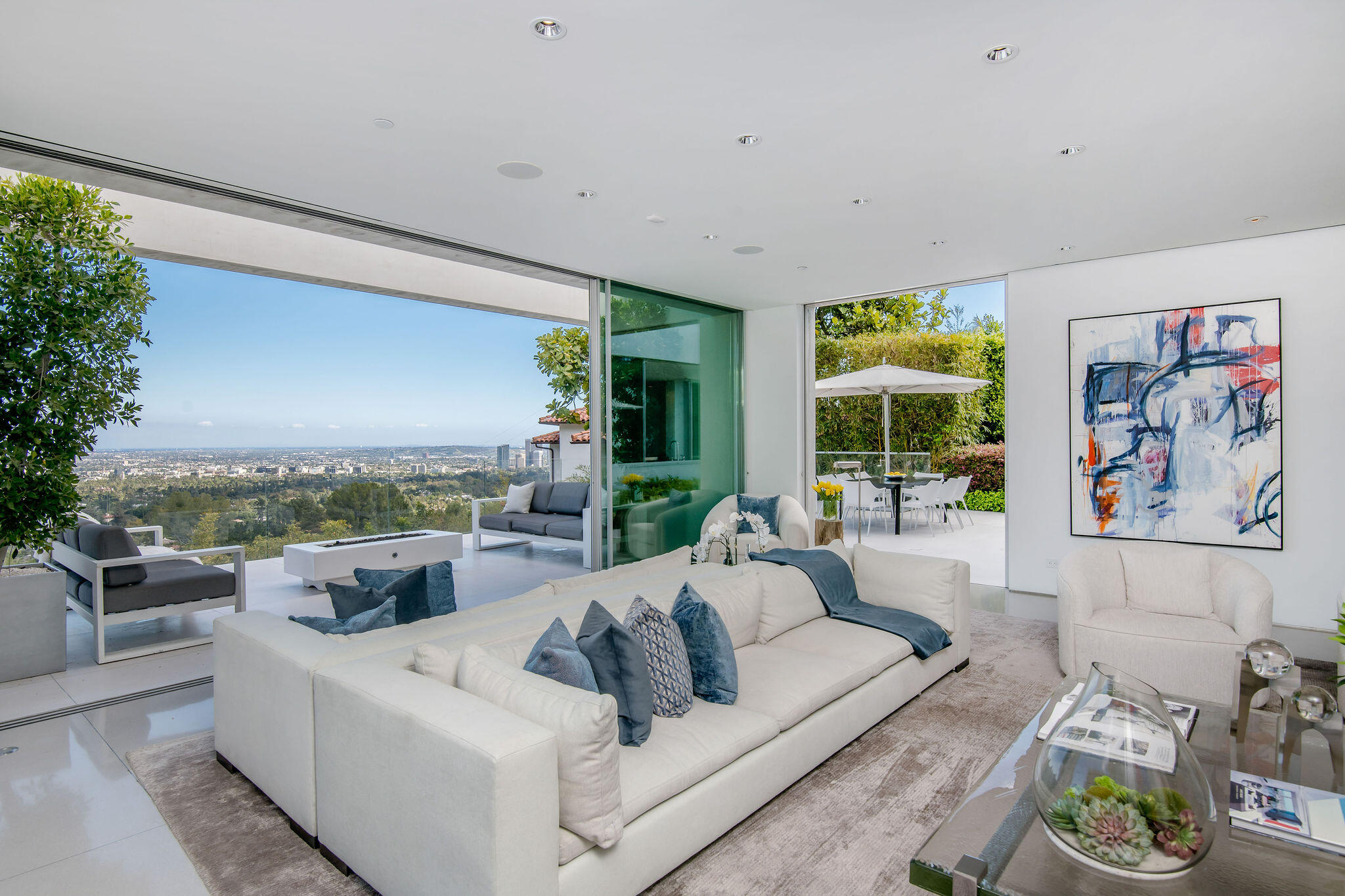 1288 Angelo Drive Beverly Hills, CA 90210 - Photo 8 of 33 a living room with furniture and a large window