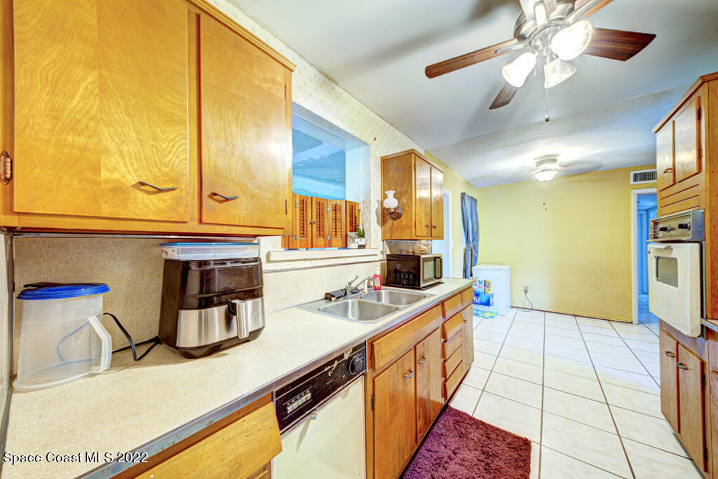 1210 Princeton Road Cocoa, FL 32922 - Photo 13 of 37 a kitchen that has a sink and a stove