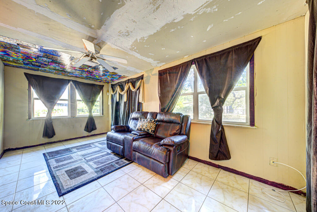 1210 Princeton Road Cocoa, FL 32922 - Photo 16 of 37 a living room with furniture and a fireplace