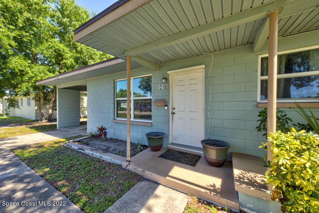 1210 Princeton Road Cocoa, FL 32922 - Photo 2 of 37 a view of a house with backyard and sitting area