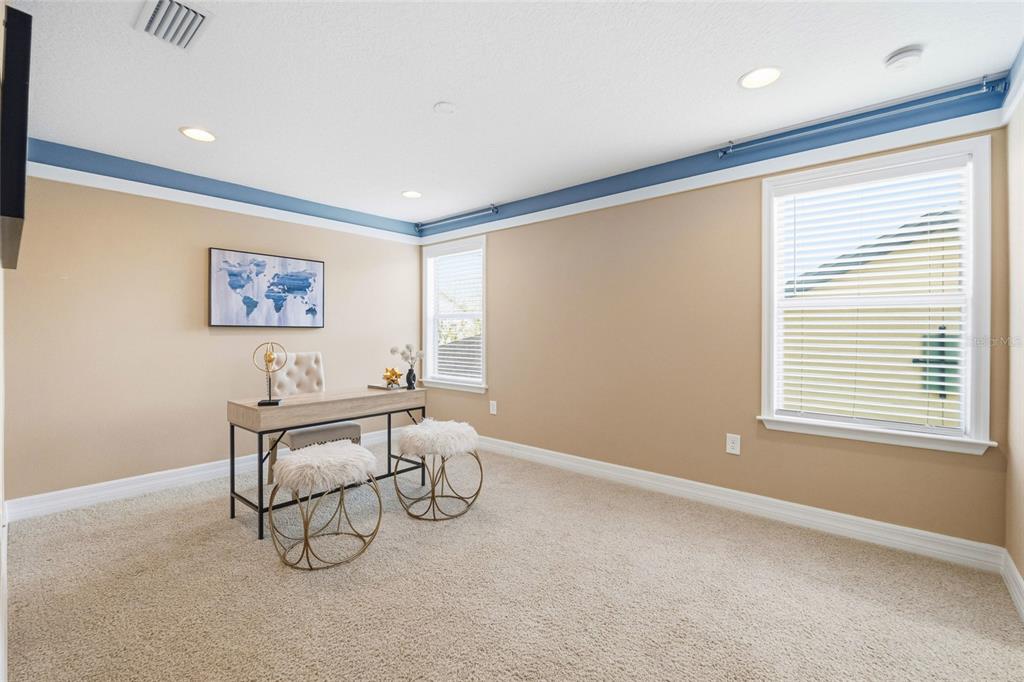 4527 Scarlet Loop Wesley Chapel, FL 33544 - Photo 12 of 33 a view of a livingroom with furniture and window