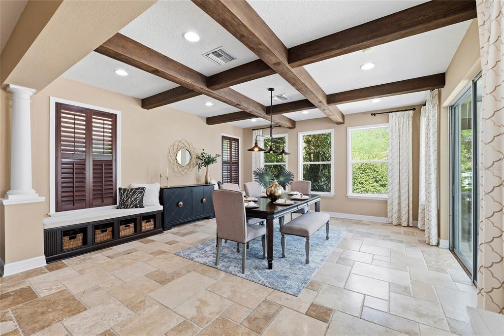 4527 Scarlet Loop Wesley Chapel, FL 33544 - Photo 5 of 33 a dining room with furniture a large window and wooden floor