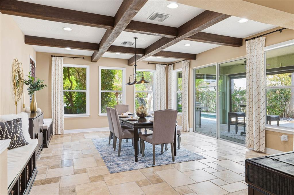 4527 Scarlet Loop Wesley Chapel, FL 33544 - Photo 6 of 33 a dining room with furniture and large windows