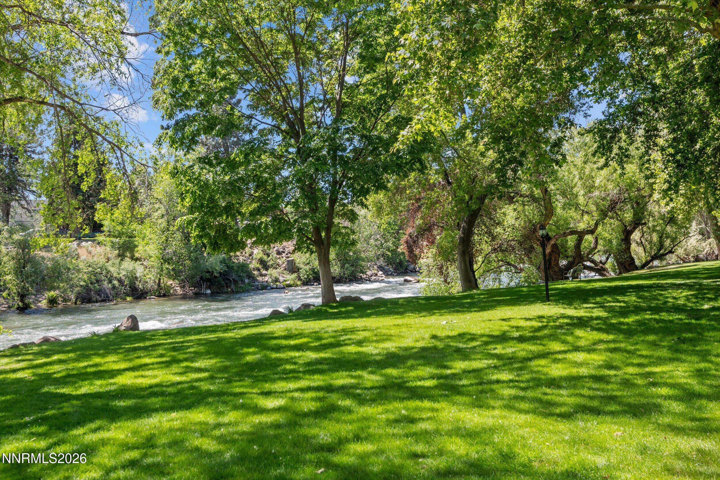 2300 Dickerson Road, Unit 51 Reno, NV 89503 - Photo 32 of 46 a backyard of a house with lots of green space and fountain