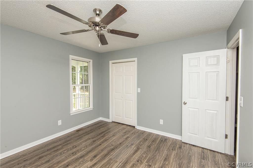 17550 Interstate Lane Dewitt, VA 23840 - Photo 14 of 29 a view of an empty room with wooden floor and a window