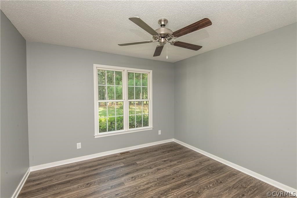 17550 Interstate Lane Dewitt, VA 23840 - Photo 17 of 29 a view of a big room with wooden floor closet and windows