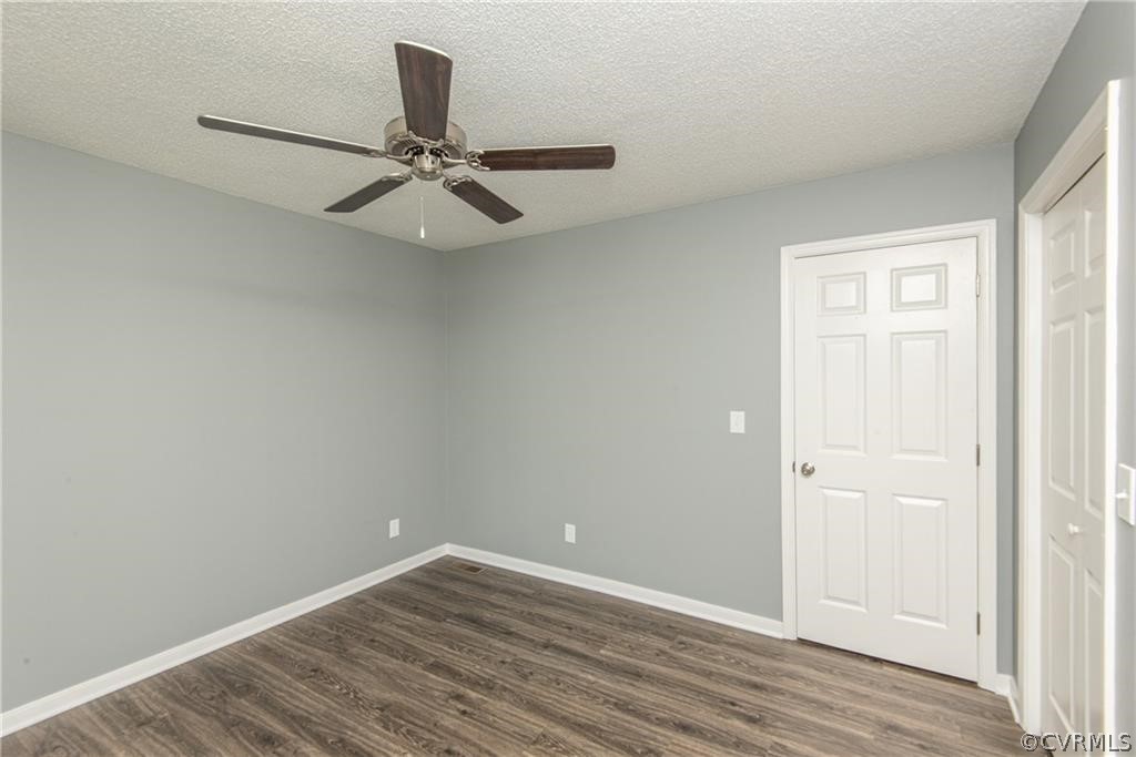 17550 Interstate Lane Dewitt, VA 23840 - Photo 19 of 29 an empty room with wooden floor ceiling fan and windows