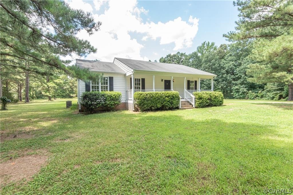 17550 Interstate Lane Dewitt, VA 23840 - Photo 2 of 29 a view of a house with a big yard plants and large trees