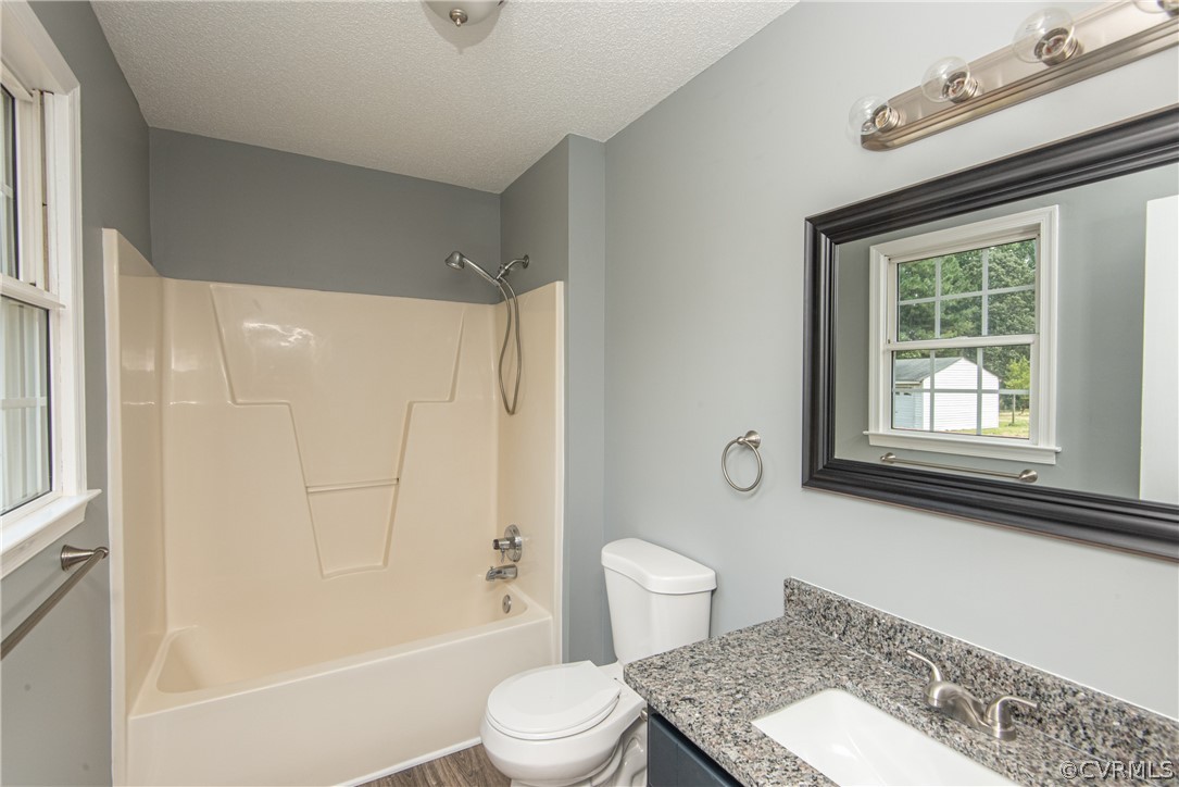 17550 Interstate Lane Dewitt, VA 23840 - Photo 21 of 29 a bathroom with a toilet a sink and a bathtub