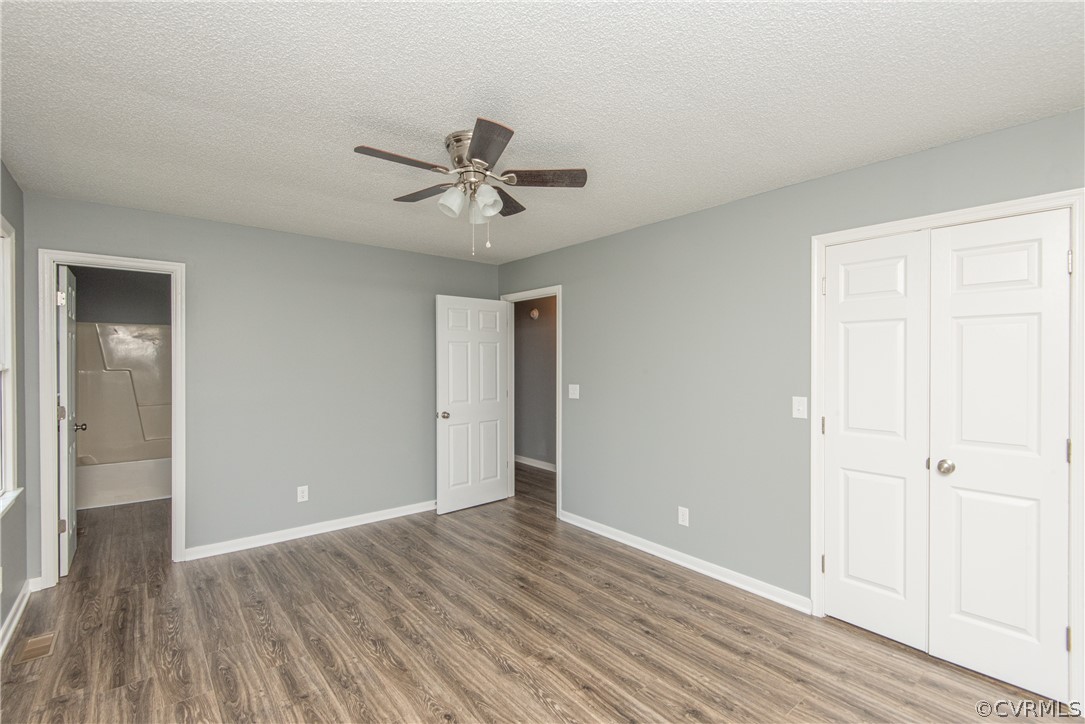17550 Interstate Lane Dewitt, VA 23840 - Photo 22 of 29 a view of room with wooden floor and ceiling fan