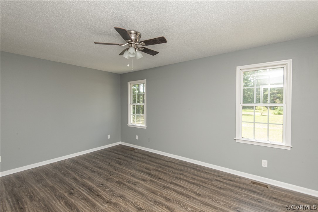 17550 Interstate Lane Dewitt, VA 23840 - Photo 24 of 29 a view of an empty room with wooden floor and a window