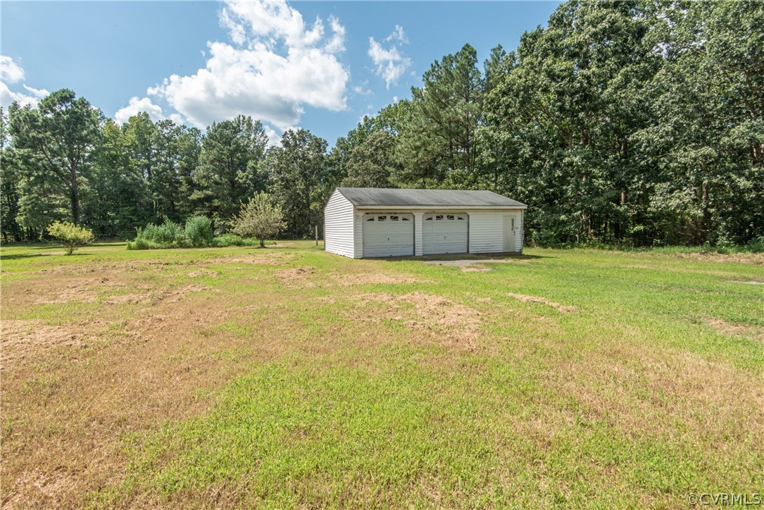 17550 Interstate Lane Dewitt, VA 23840 - Photo 25 of 29 a view of a big yard with an tree and wooden fence