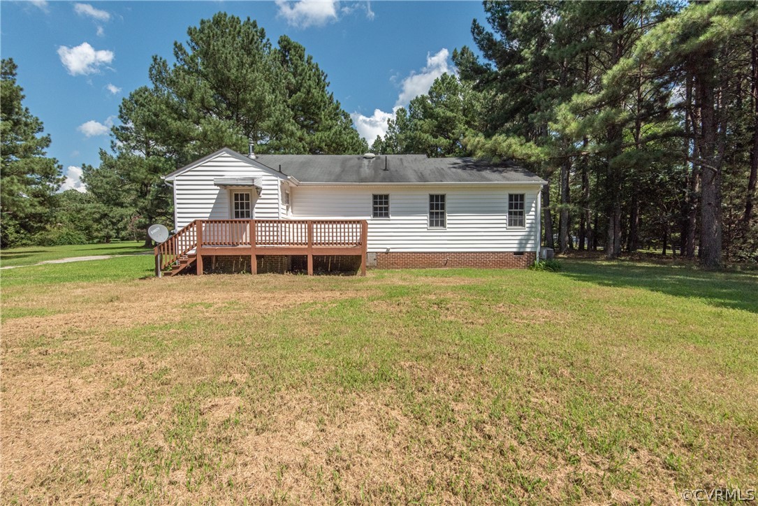17550 Interstate Lane Dewitt, VA 23840 - Photo 26 of 29 a backyard of a house with table and chairs