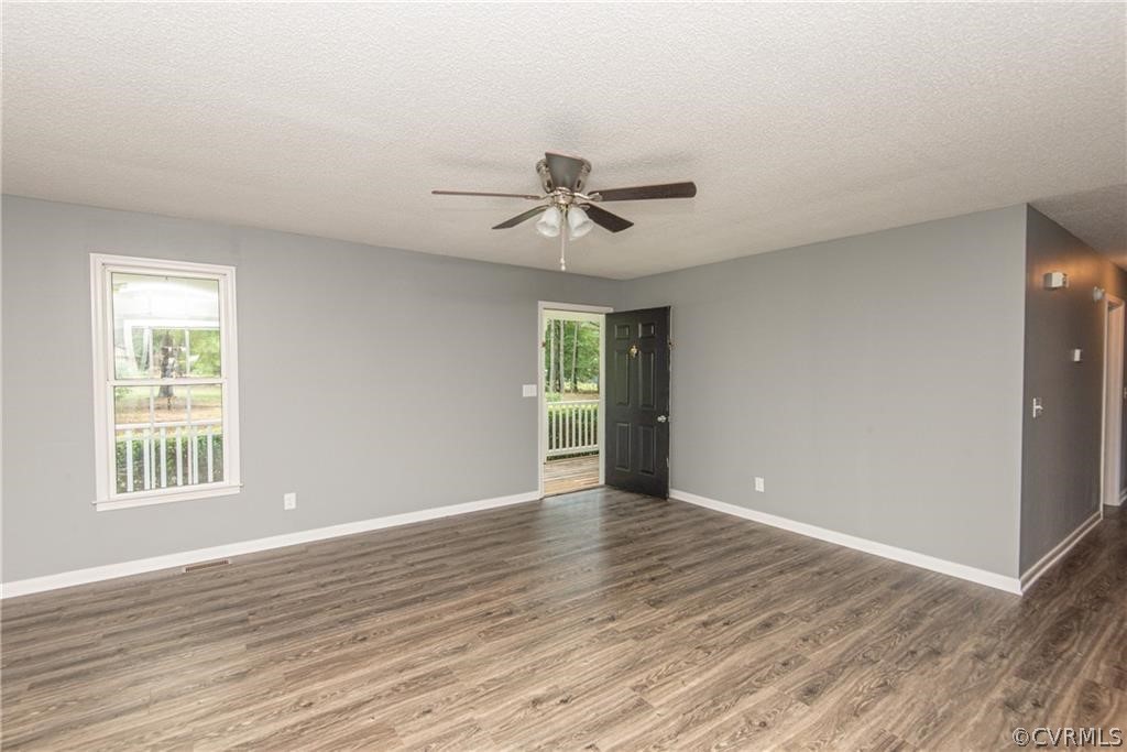 17550 Interstate Lane Dewitt, VA 23840 - Photo 4 of 29 a view of an empty room with window and wooden floor