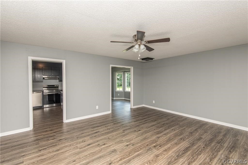 17550 Interstate Lane Dewitt, VA 23840 - Photo 6 of 29 a view of an empty room with window and wooden floor