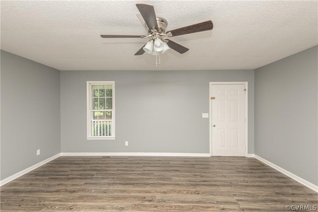 17550 Interstate Lane Dewitt, VA 23840 - Photo 8 of 29 a view of an empty room with wooden floor and a window