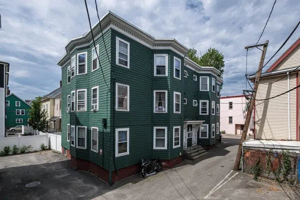 a view of a building with a yard