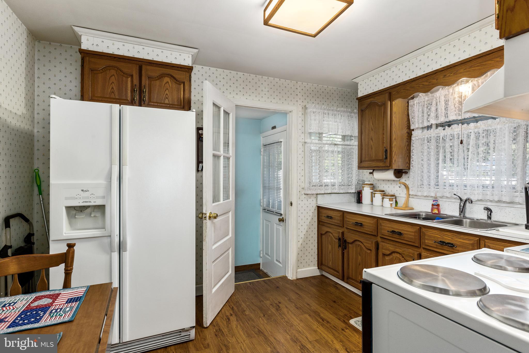 5 Cedar Lane Pemberton, NJ 08068 - Photo 11 of 27 Rear door view off the kitchen with bsmt access