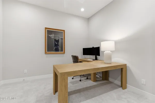 a room with a table and a flat screen tv