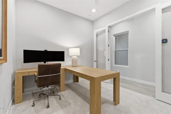 a view of a workspace with furniture