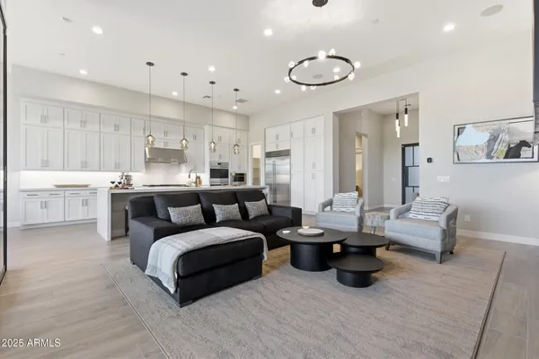 a living room with furniture and a large window