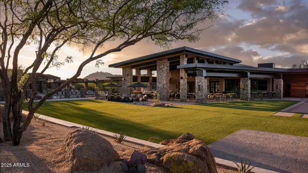 a view of a house with swimming pool and porch with furniture