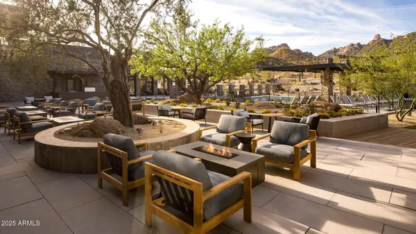 a view of a terrace with couches and a fire pit