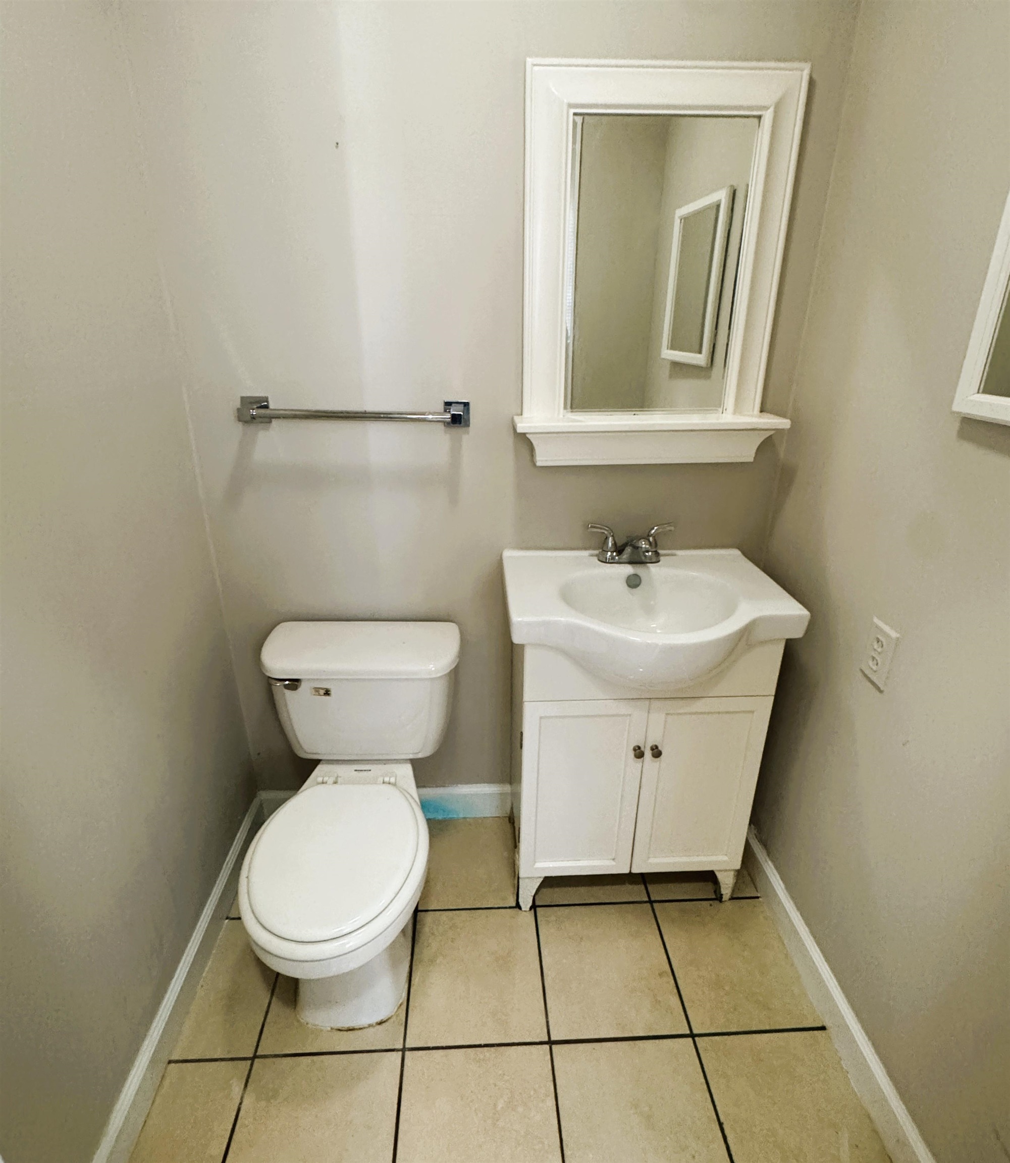 1331 Colonial Road Memphis, TN 38117 - Photo 16 of 18 a bathroom with a sink toilet and a mirror
