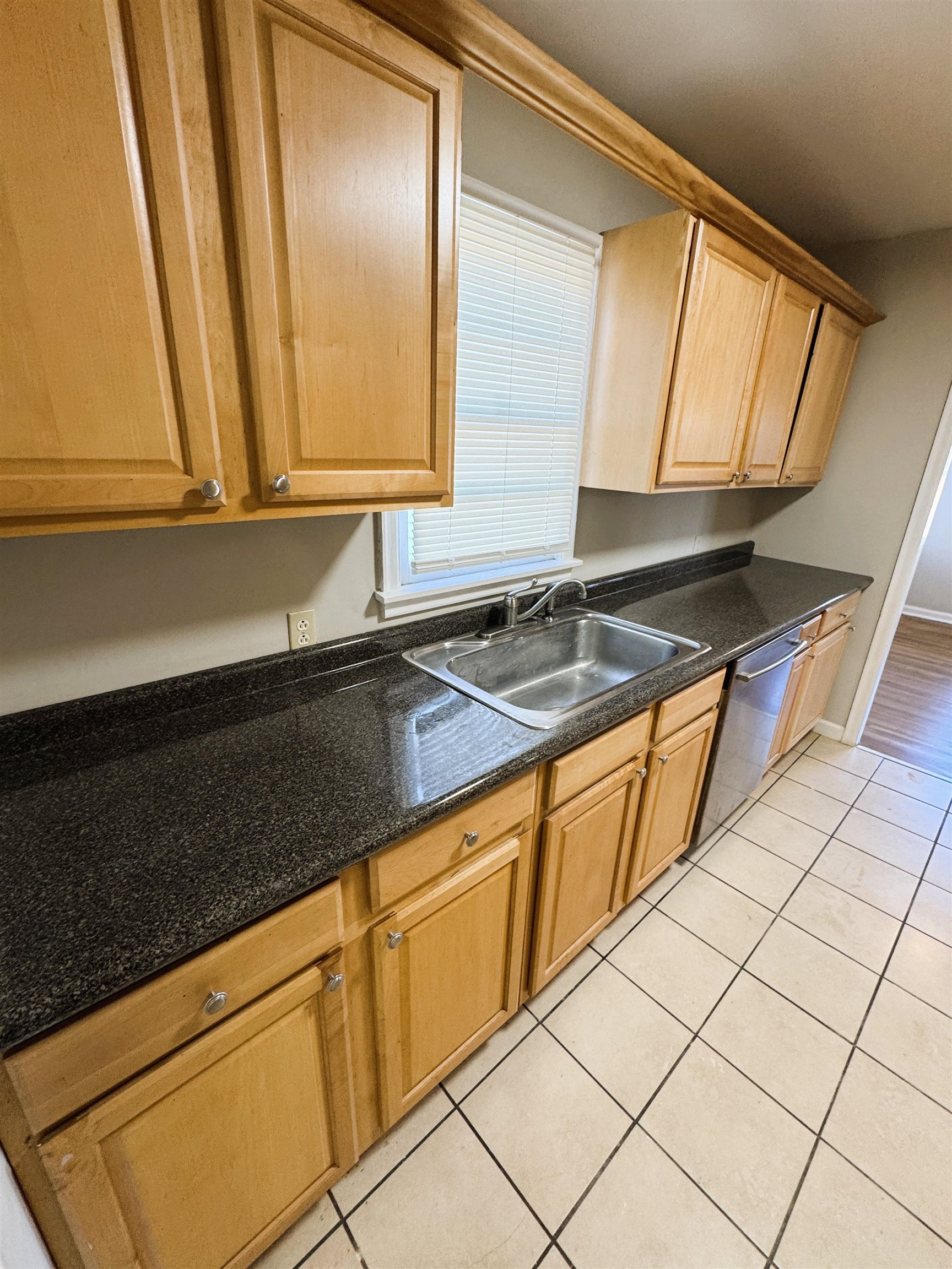 1331 Colonial Road Memphis, TN 38117 - Photo 7 of 18 a kitchen with granite countertop cabinets sink and a granite counter top