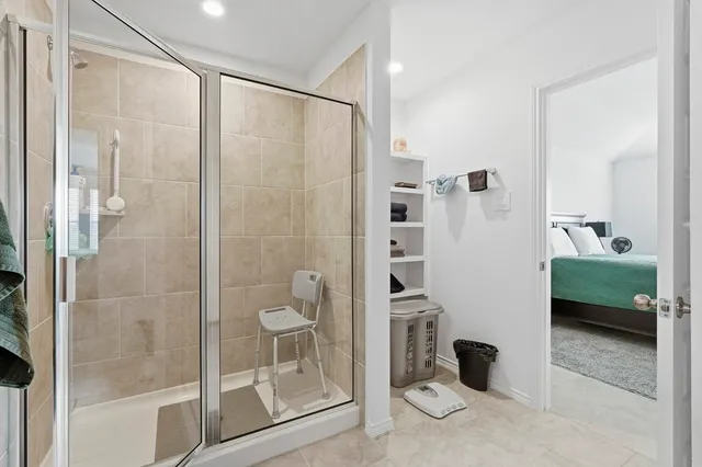 a bathroom with a shower and a sink