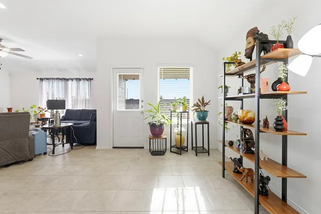 a view of a livingroom with furniture and a window