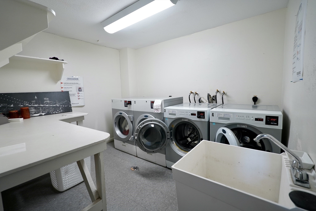 92 Beacon Street, Unit 6 Lawrence, MA 01843 - Photo 15 of 22 a utility room with dryer and washer