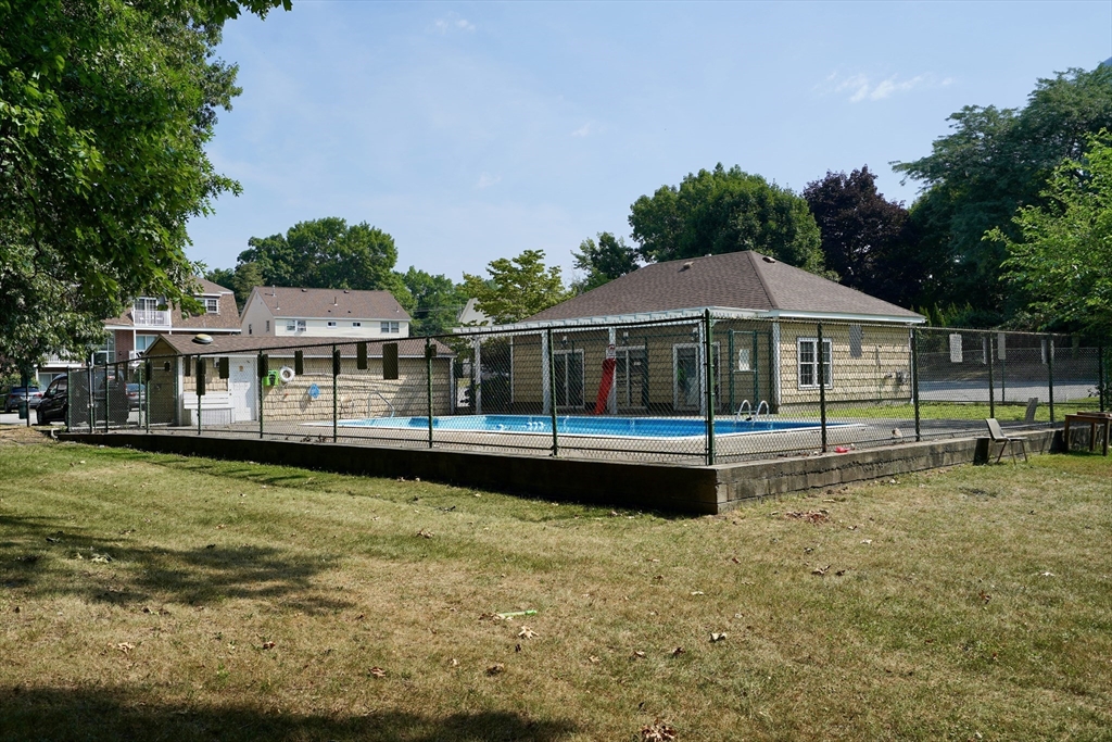92 Beacon Street, Unit 6 Lawrence, MA 01843 - Photo 20 of 22 a view of a house with swimming pool and sitting area