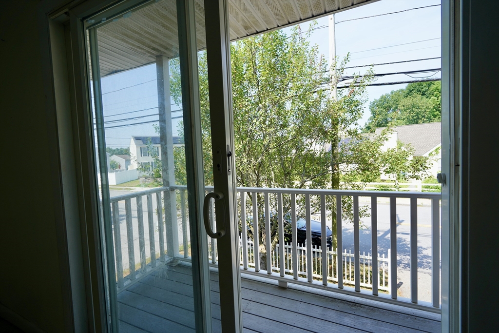 92 Beacon Street, Unit 6 Lawrence, MA 01843 - Photo 8 of 22 a view of balcony with wooden floor
