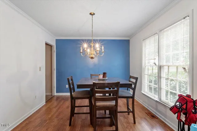 a view of a livingroom with furniture and hardwood floor