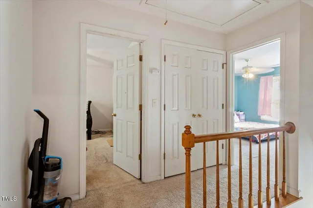 a bathroom with a sink mirror vanity and toilet