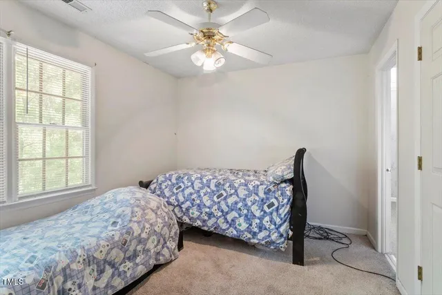 a view of a hallway with closet and a mirror