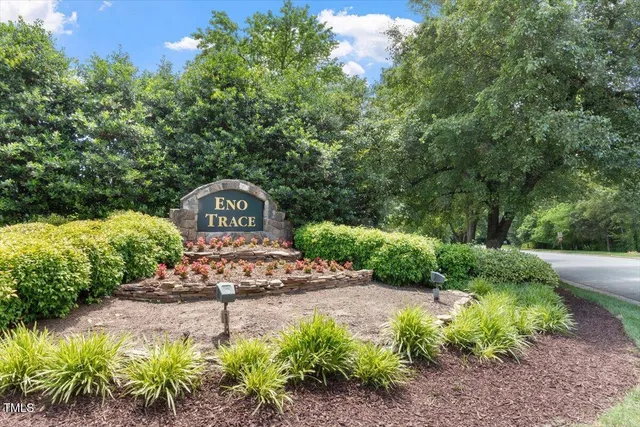 a view of a deck and yard with wooden fence